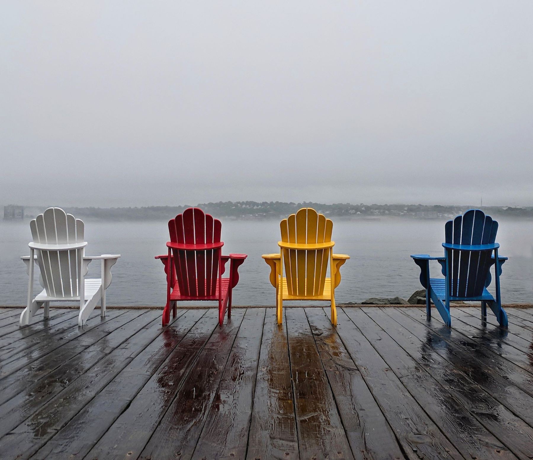 Rain holiday 4. Wooden Beach Chair near the Wall.